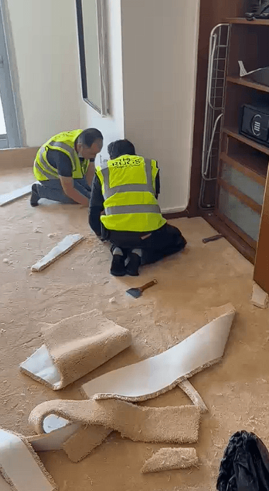 THE RUGS team carrying out carpet installation at Kempinski Dubai Mall